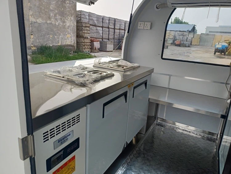 salad prep table in the small ice cream trailer